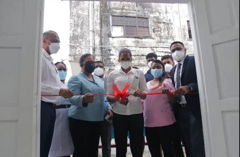 HIV/AIDS Counsellor Melagreta Pearce cutting the ceremonial ribbon to officially declare open the infectious diseases clinic at the Suddie Public Hospital