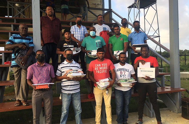 Representatives of the clubs pose, after the presentation, with BCB president Hilbert Foster, Member of Parliament Faizal Jafferally and WBCA president, David Black.