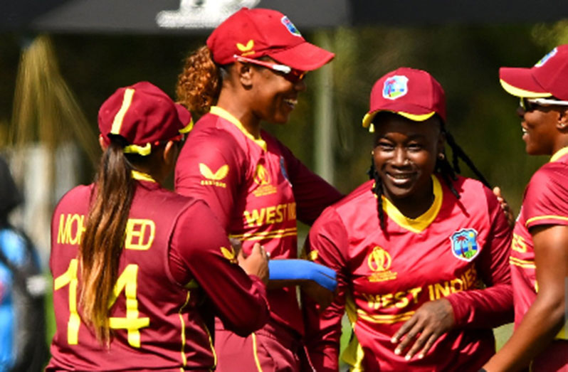 Deandra Dottin (second from right) is congratulated by teammates following her brilliant catch against England