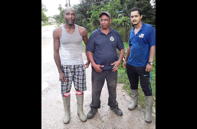Chairman of the Kwakwani CPG, Arthur DeNobrega (centre), flanked by Tofawa Thomas and Garfield Cummings after they were found