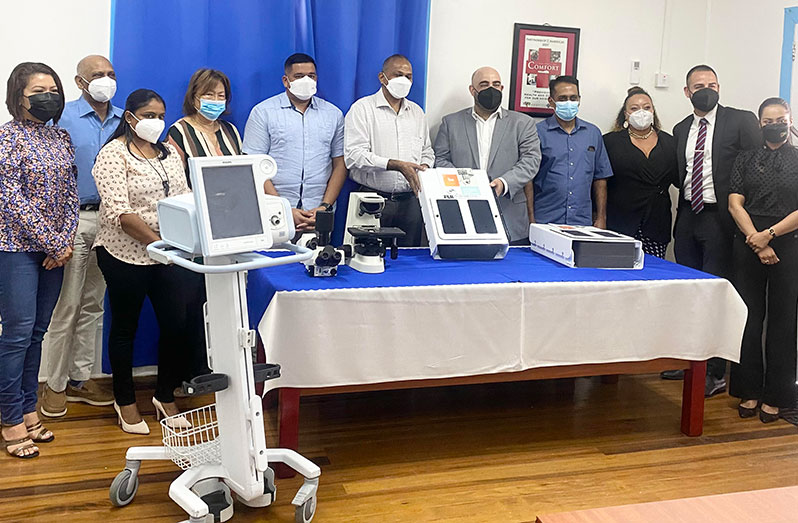 CEO (ag) of the Georgetown Public Hospital Corporation, Robbie Rambarran; Minister of Health, Dr Frank Anthony; Director of Global Health, Northwell Health, Dr Eric Cioe Peña, and others at the handing-over ceremony (Cassandra Khan photo)