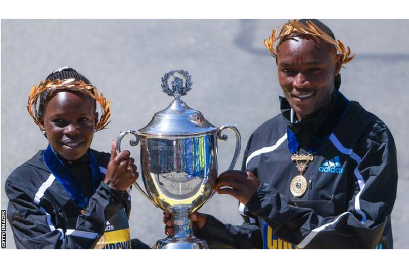 Kenya's Peres Jepchirchir (left) and Evans Chebet celebrate their Boston success. (Getty Images)