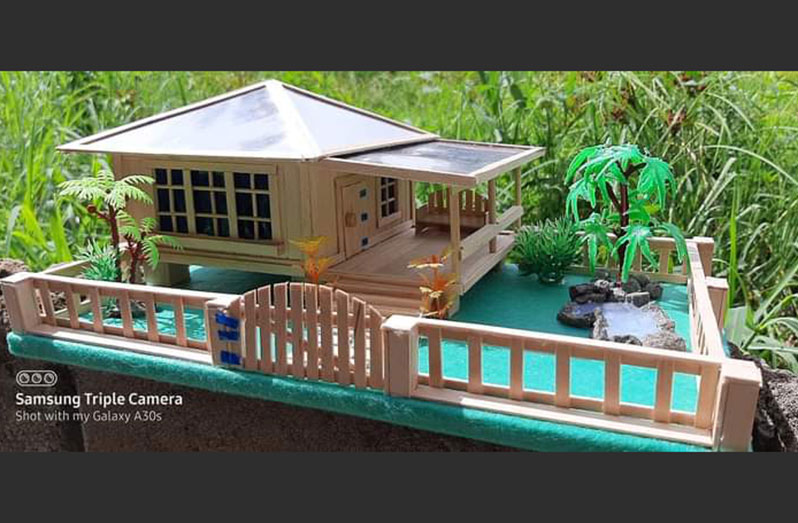 Lisa created this miniature stick house with a mini pond, yard space and trees as a gift for her mother-in-law