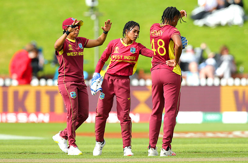 Shemaine Campbelle congratulates Chinelle Henry for dismissing Ashleigh Gardner (ICC via Getty Images)