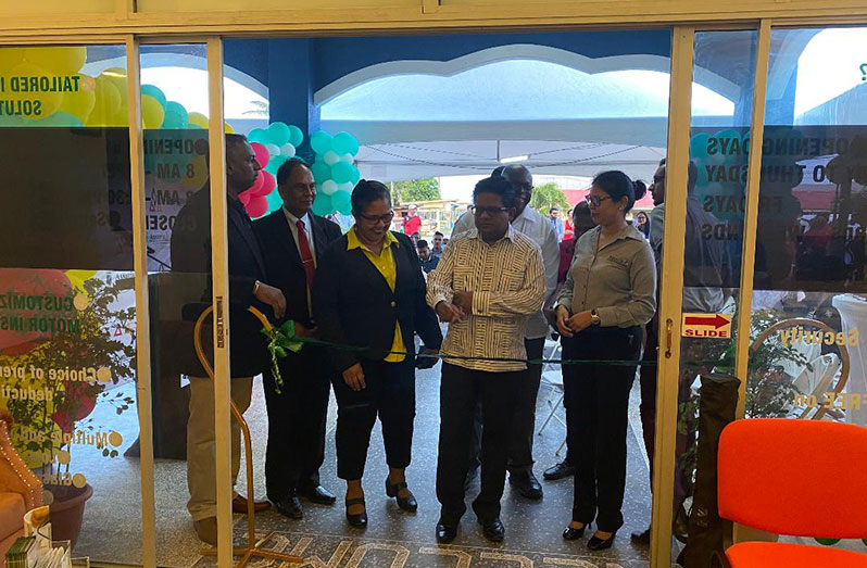 Senior Minister in the Office of the President with Responsibility for Finance, Dr Ashni Singh (second right) at the cutting of the ceremonial ribbon as Region Two Chairperson, Vilma De Silva (third left) and others look on