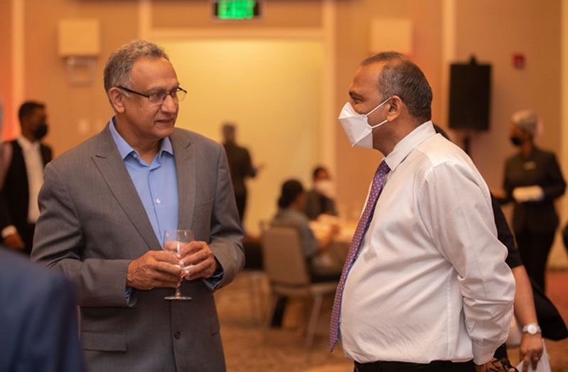 Minister of Health, Dr. Frank Anthony speaking with Infectious Diseases Specialist (US/Guyana), Dr. Moti Ramgopal