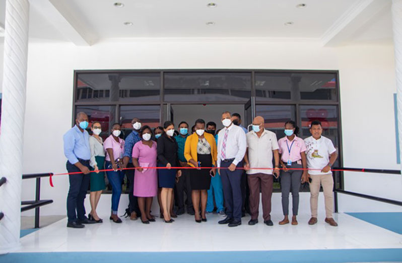 Regional Health Officer (RHO) of Region Three, Dr Erica Forte, supported by Health Minister Dr Frank Anthony and other officials cut the ribbon to declare open the new blood bank (DPI photo)