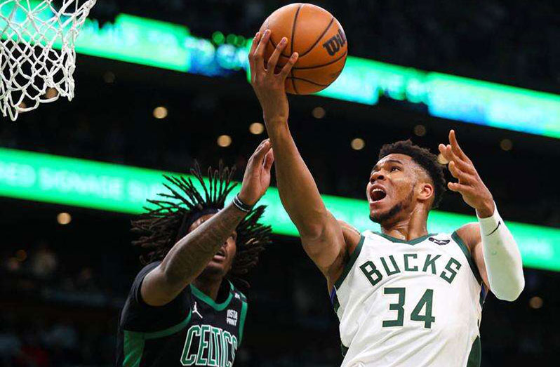 Giannis Antetokounmpo (right) of Milwaukee Bucks drives to the basket past Robert Williams of Boston Celtics during Game One of the Eastern Conference Semi-finals at TD Garden in Boston, Massachusetts on Sunday. (Photo: AFP)