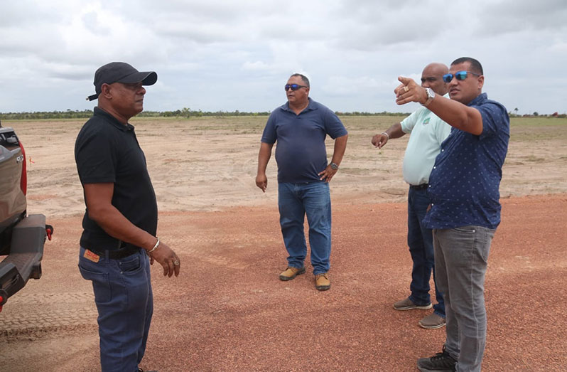 Minister of Housing and Water Collin Croal and Mayor John Macedo (second from right), along with contractors, at the new Lethem Track 'A' Housing Scheme