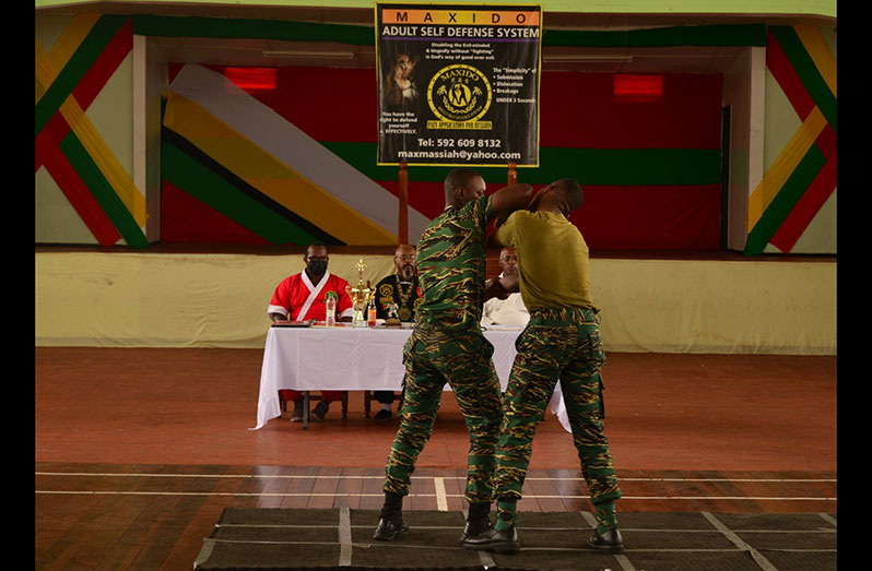 Soldiers demonstrate an aspect of the Maxido techniques taught to them