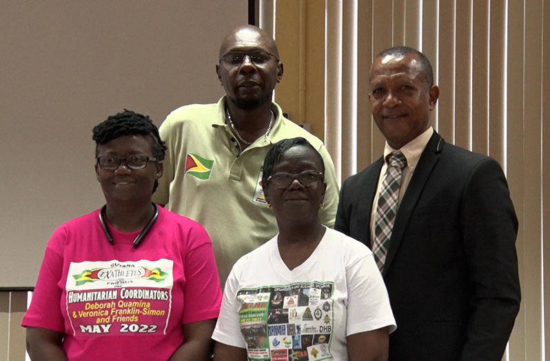 From left:  Deborah Quamina, Mark Bradford, Burgette Williams-Forde, president of the Guyana Ex-Athletes and Friends Inc., and Athletics Guyana president, Aubrey Hutson, at the event on Tuesday at the National Racquet Centre