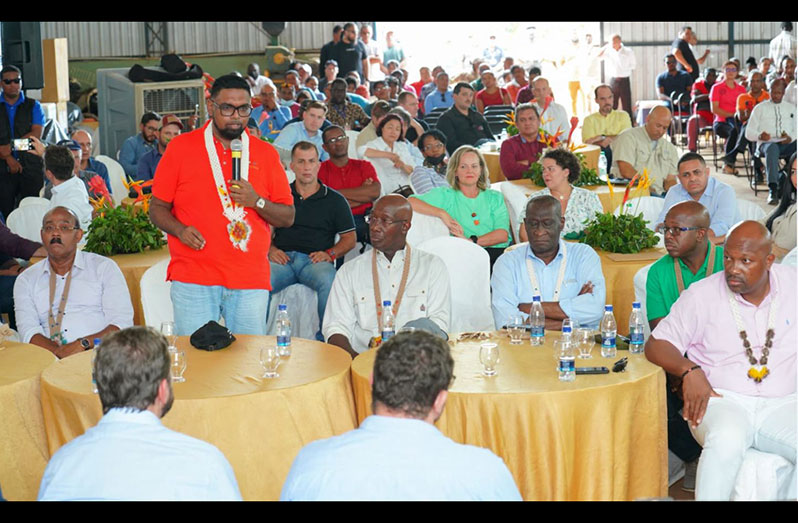 President, Dr Irfaan Ali speaking at the Caribbean-Roraima Investors Luncheon at the Santa Fe farm in the North Rupununi as Antigua and Barbuda Prime Minister Gaston Browne (left), Trinidad and Tobago Prime Minister Dr Keith Rowley (right) and regional officials pay keen attention (Office of the President photo)