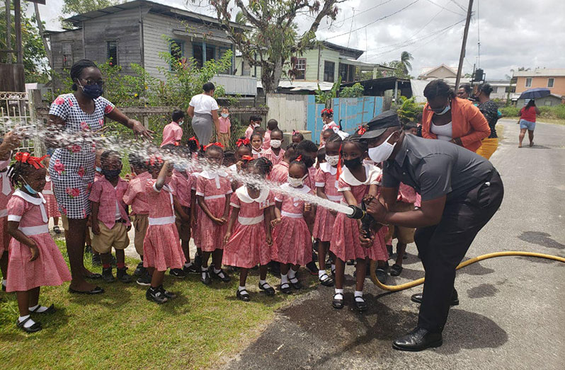 These Prospect Nursery School children were ‘treated’ to the use of the fire hose by a rank of the GFS