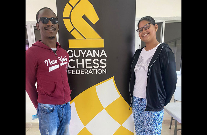 Wendell Meusa (left) and teenager Pooja Lam are champions of the GAICO National Open Chess Championship and the KFC/Guyana-sponsored Women’s Nationals