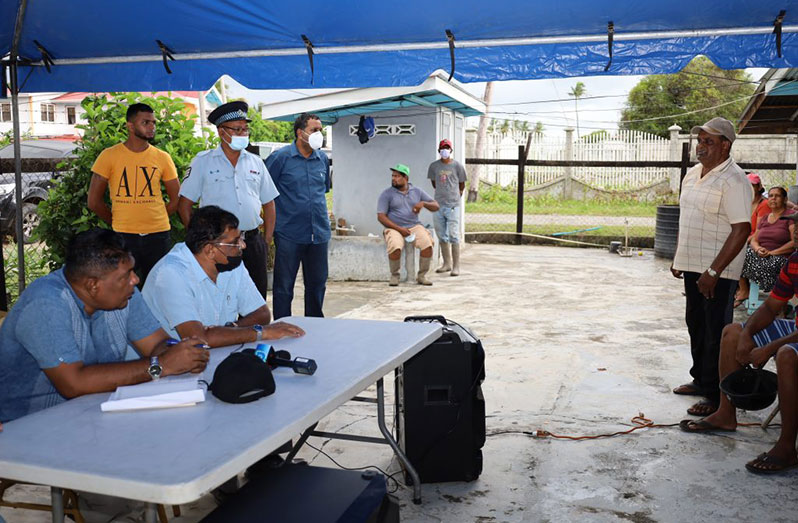 Minster of Agriculture, Zulfikar Mustapha, listens to a concern being raised by a resident during one of Saturday’s community meetings (Ministry of Agriculture photo)