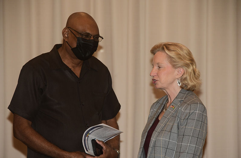 Chief Elections Officer, Vishnu Persaud (left) speaking with US Ambassador, Sarah Ann-Lynch, at the launch (Adrian Narine photo)