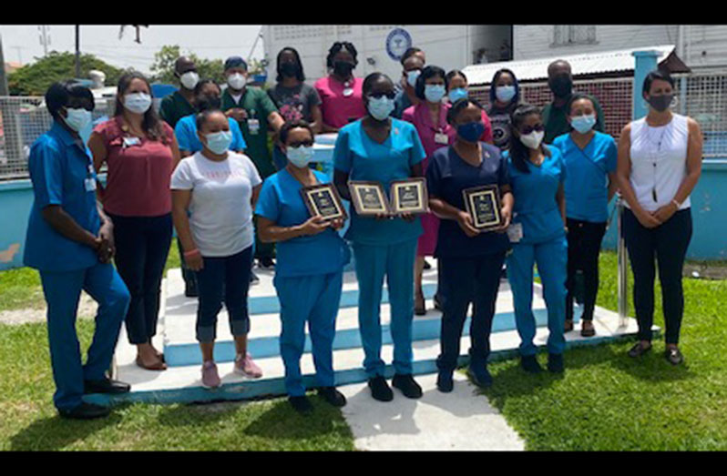 The nurses who received their awards posed with other officials and the visiting team (GPHC photo)