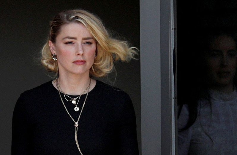 Amber Heard leaves Fairfax County Circuit Courthouse after the jury announced split verdicts in the Depp v. Heard civil defamation trial at the Fairfax County Circuit Courthouse in Fairfax, Virginia, U.S., June 1, 2022. REUTERS/Tom Brenner/File Photo