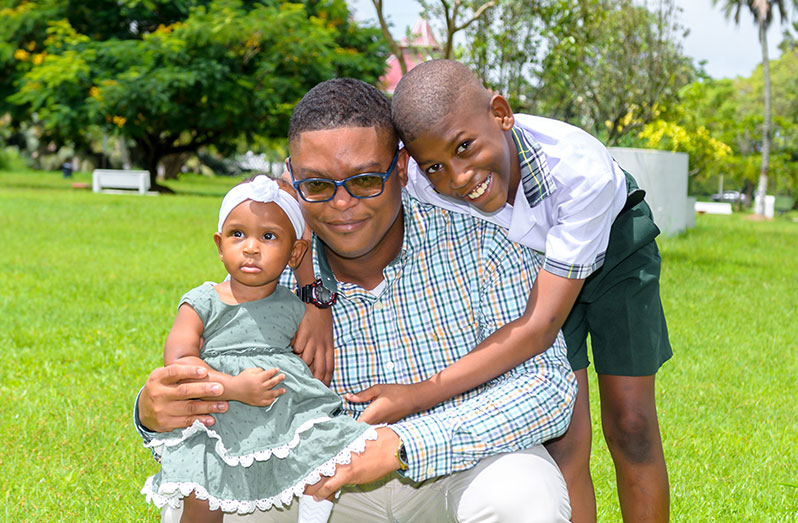 Dellon Kurtlan Johnson and his children Elianah and Eli. Johnson states that there is a great need for love, care and responsibility when it comes to being a father. ( Delano Williams Photo)