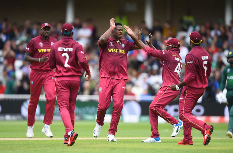 The West Indies team celebrate