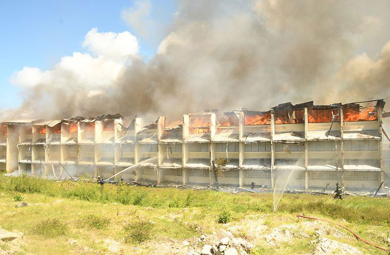 The main building of the North Ruimveldt Multilateral School engulfed in fire on June 19, 2021