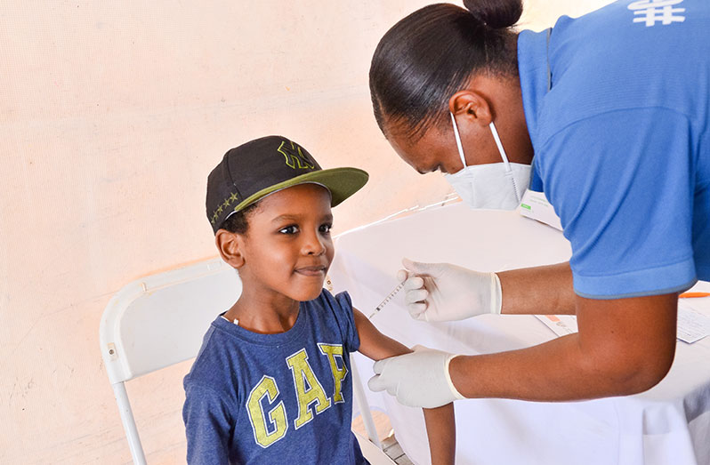 A brave boy! Six-year-old Mohammed Scott took his COVID-19 vaccine without flinching (Delano Williams photo)