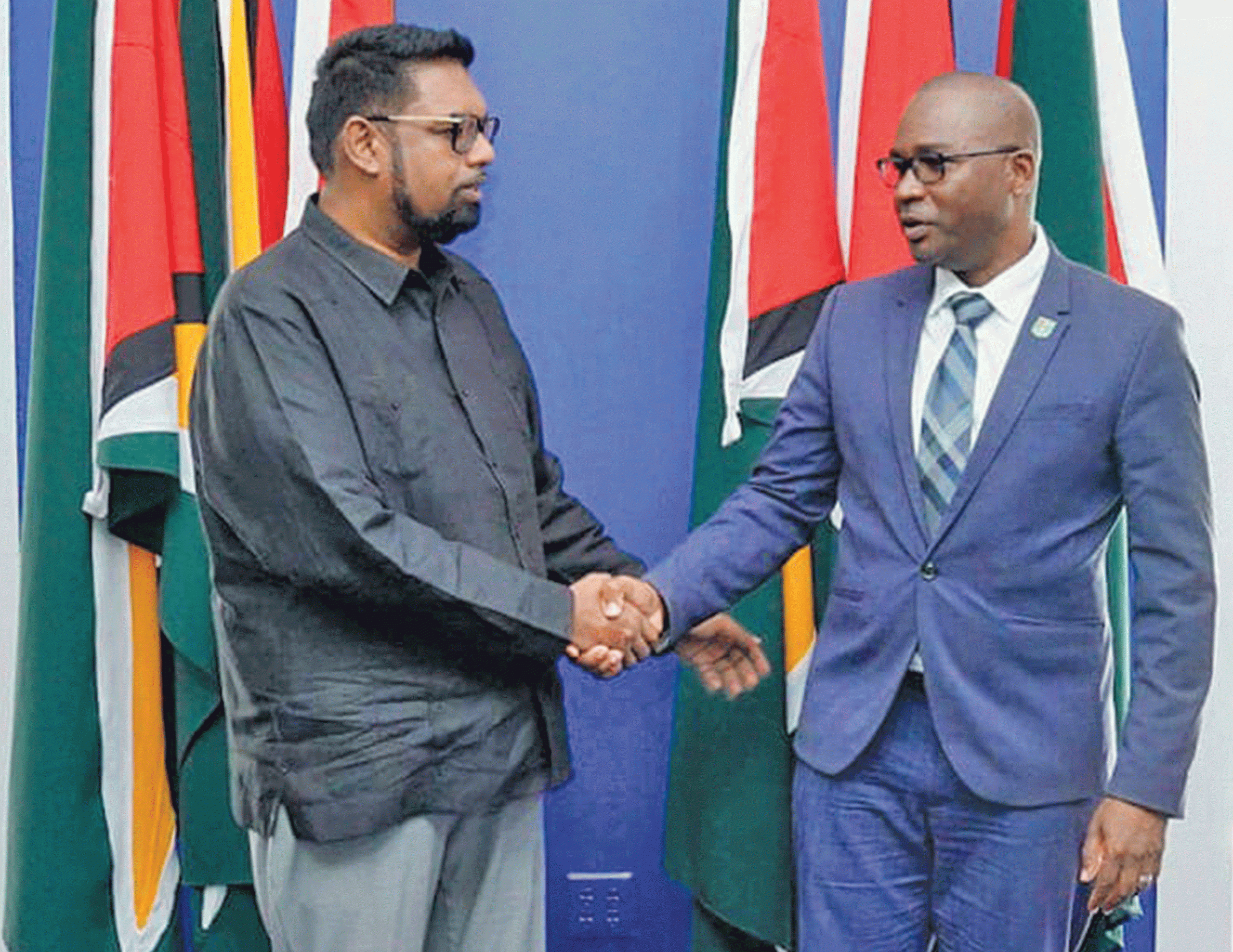 President Dr. Irfan Ali (L) greeting GFF president, Wayne Forde, ahead of their meeting at State House