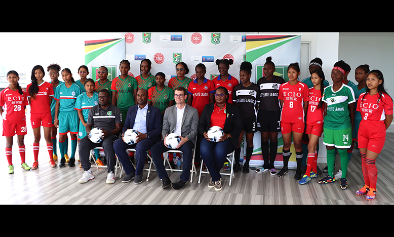 Seated from left: Assistant Technical Director, Bryan Joseph, GFF president Wayne Forde, UEFA’s Chris Milnes and Women’s Football President, Andrea Johnson, along with some participants of the League