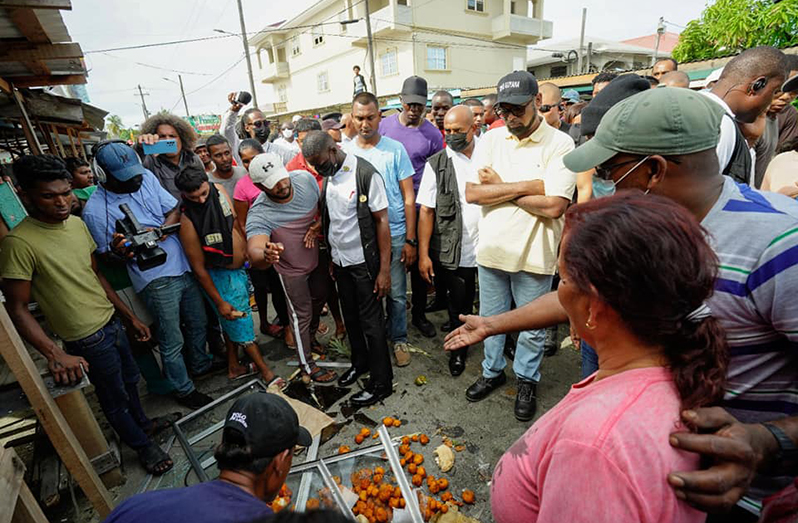 President Dr. Irfaan Ali engaging vendors at the Mon Repos Market (Office of the President photo)