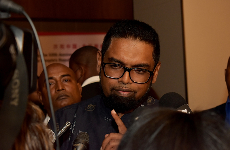 President Irfaan Ali engaging members of the media on Wednesday on the side lines of an event at the Pegasus Corporate Suites, Kingston (Carl Croker photo)