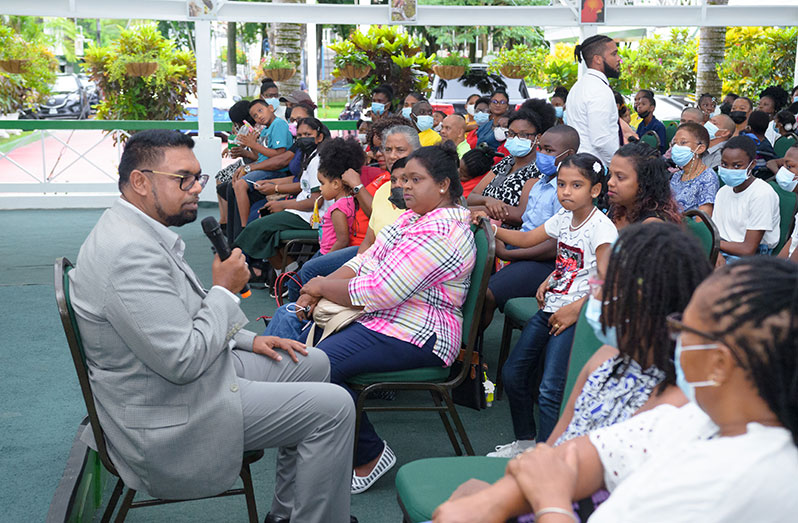 President Dr. Irfaan Ali engaging parents of children living with disabilities at State House, on Friday (Delano Williams photo)