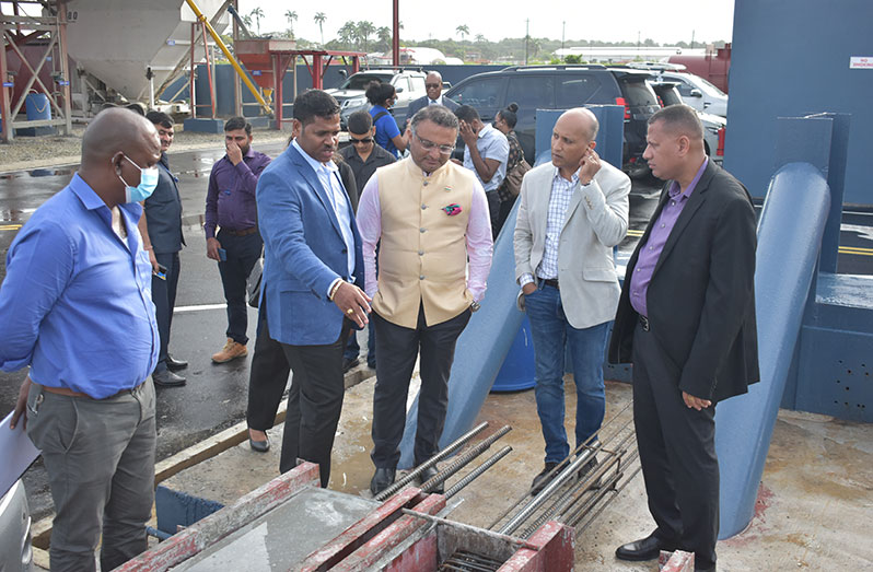 Businessman Suresh Jagmohan (second left) gives Indian High Commissioner to Guyana, Dr KJ Srinivasa (left), President of the Guyana Manufacturers and Services Association (GMSA) Rafeek Khan, and Minister of Housing and Water, Colin Croal, a tour of the facility (Elvin Corker photo)