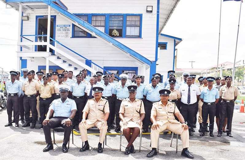 Seated from left: Sergeant Eldon Sobers; Force Traffic Officer, Senior Superintendent Ramesh Ashram; Woman Chief Inspector Natasha Alder, and Inspector Michael Ramdass, flanked by the forty-four newly trained GPF drivers