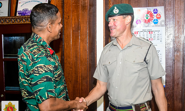 Chief-of-Staff (ag), Colonel Omar Khan, greets UK Military Attaché to the Caribbean, Lieutenant Colonel Simon Westlake, at Defence Headquarters, Base Camp Ayanganna (GDF photo)