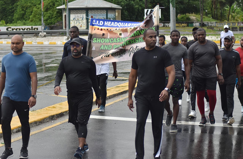 Deputy Commissioner, Law Enforcement, Wendell Blanhum, leads the way in the "Fitness Walk and Run" from the University of Guyana Access Road, East Coast of Demerara, to the CID HQ, Eve Leary, Kingston, Georgetown (GPF Photo)