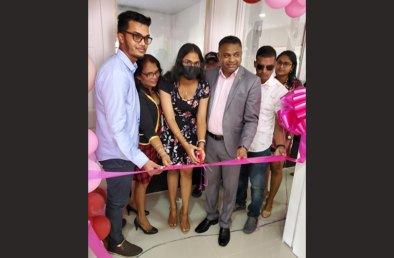 Minister within the Ministry of Public Works Deodat Indar joins the Kanhai family for the ceremonial ribbon-cutting exercise to declare open the new PK’s Super Clean Laundromat (Photos sourced from Minister Deodat Indar’s official Facebook page)