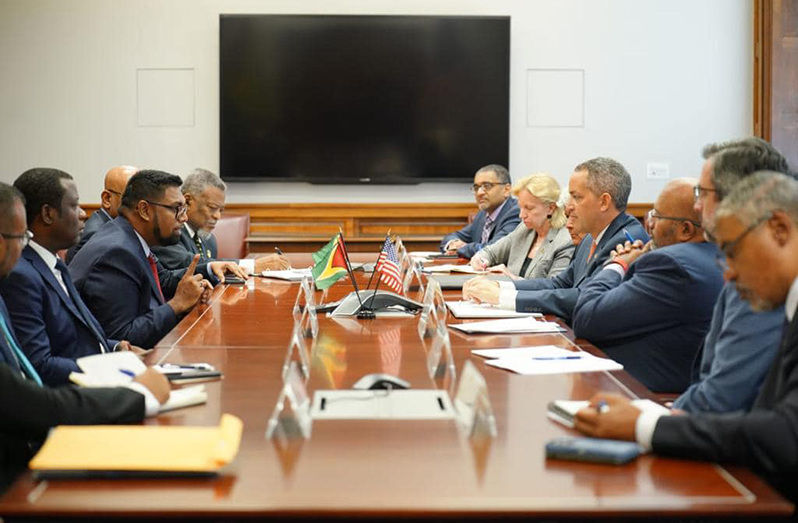 President, Dr Irfaan Ali flanked by his team while speaking to US Deputy Secretary of Commerce, Don Graves on various developmental agendas in Washington DC.
