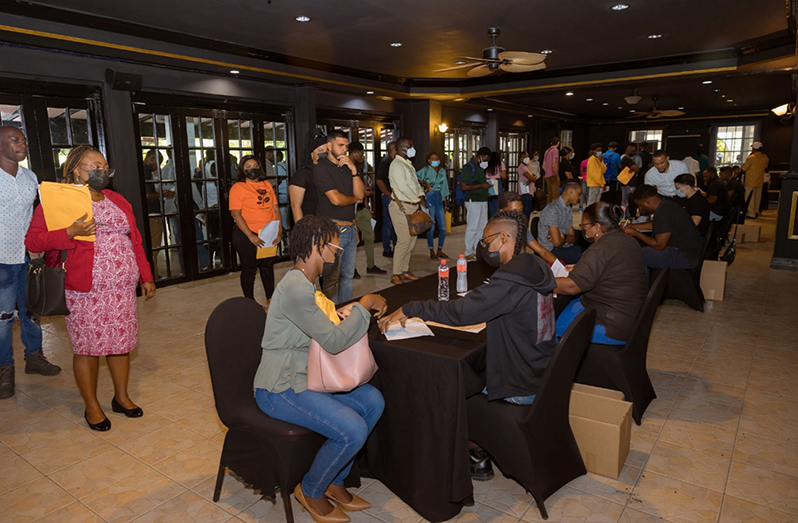 A section of the gathering inside the Georgetown Club waiting to be interviewed at the recent Mining Industry Career Fair, hosted by Excel Guyana