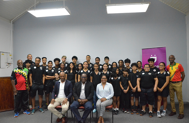 Team Guyana  at yesterday’s launch at the Georgetown Club with coach Carl Ince (left) and manager Garfield Wiltshire (right). In front row seated from left: Vice-president of GOA, Godfrey Munroe; Director of Sport Steve Ninvalle and Communications Manager for Digicel, Vidya Sanichara.