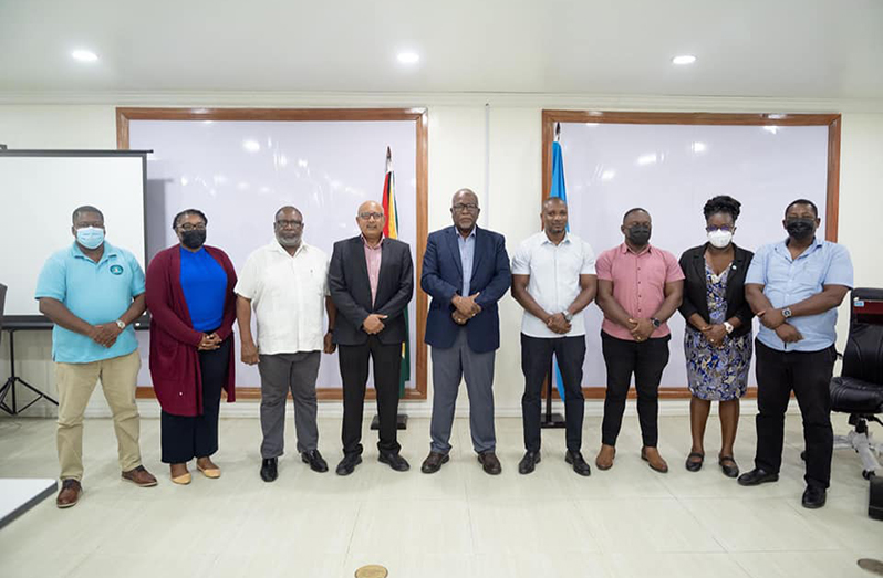 Prime Minister, Brigadier (ret’d) Mark Phillips (centre); the newly-appointed CDC Director-General, Colonel (ret’d) Nazrul Hussain (left of PM Phillips) and other officials of the CDC following a simple ceremony at the CDC’s headquarters, on Tuesday (Office of the Prime Minister photo)