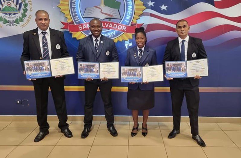In photo, from left, are: Head of the Special Organised Crime Unit (SOCU), Assistant Commissioner Fazil Karimbaksh; Officer in Charge of Immigration at the Cheddi Jagan International Airport, Timerhi, Troy Benn; Shift Commander of Immigration at the Cheddi Jagan International Airport, Timehri, Assistant Superintendent Rodella Glen, and Superintendent Krishnadat Ramana, also attached to SOCU (Guyana Police Force photo)