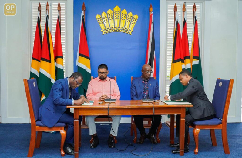 President, Dr. Irfaan Ali and Trinidad and Tobago’s Prime Minister, Dr. Keith Rowley witness the signing of the Memorandum of Understanding in May 2022 (Office of the Prime Minister photo)