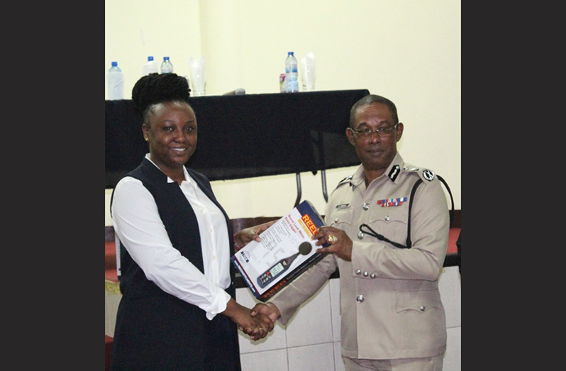 EPA’s Legal Officer, Shareefah Parks, presents the Noise Meters to Acting Commissioner of Police, Clifton Hicken, on behalf of EPA (GPF photo)