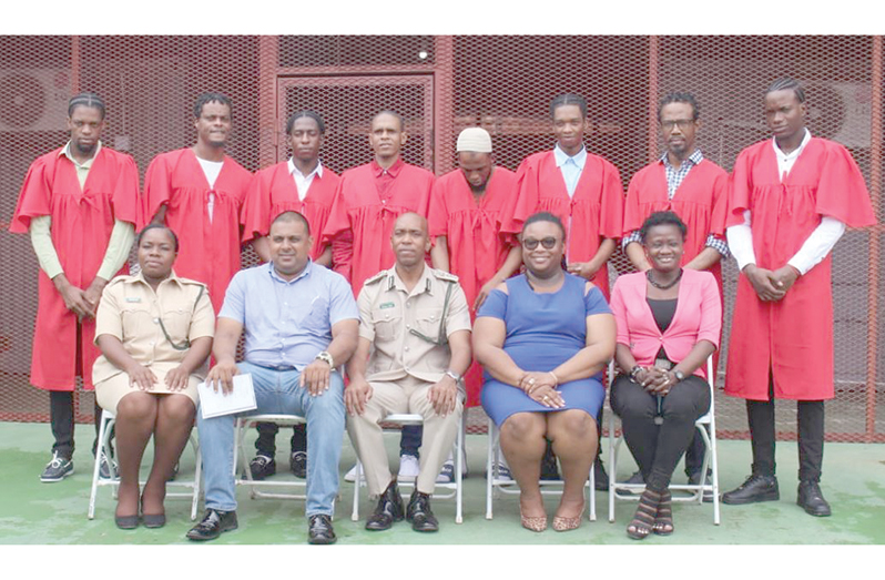 (Seated from left) Superintendent of Prisons, Olivia Cox; Founder and Chief Executive Officer (CEO) of Empower Guyana Consultancy, Amar Panday; Director of Prisons (ag), Nicklon Elliot; Officer-in-Charge of Prisons’ Welfare and Corrections, Marielle Bristol-Grant; and Tessa McGarrell with eight inmates (GPS photo)