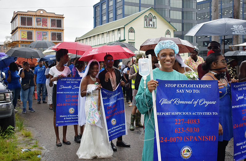 A scene from Friday’s Counter Trafficking in Persons (TIP) Unit awareness walk and exhibition (Carl Elvin Croker photo)