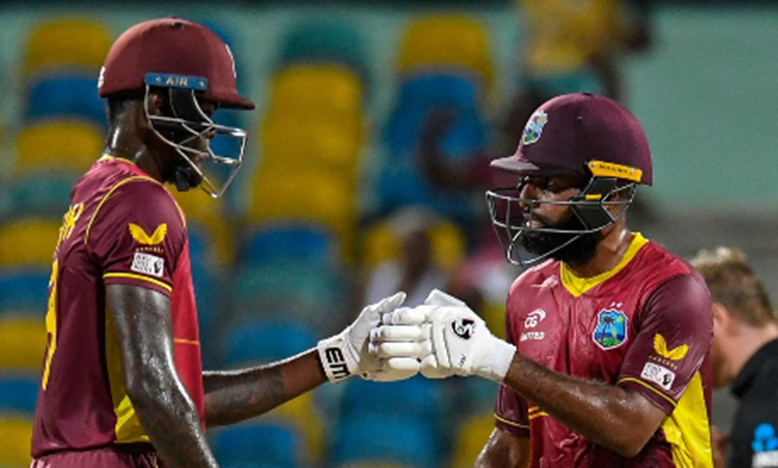 Alzarri Joseph (left) and Yannic Cariah during their record ninth-wicket stand on Friday