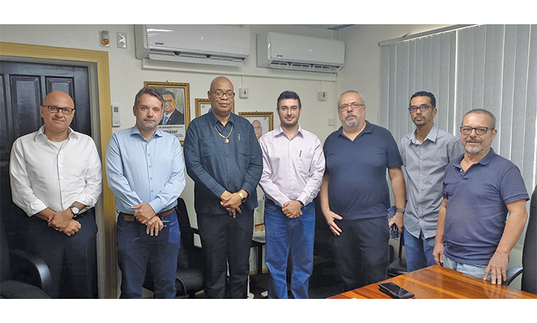 Public Works Minister, Bishop Juan Edghill, with members of the Brazilian team