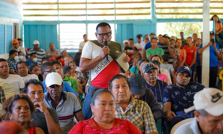 A resident of Orealla raises a concern during the meeting on Saturday (Office of the President photo)