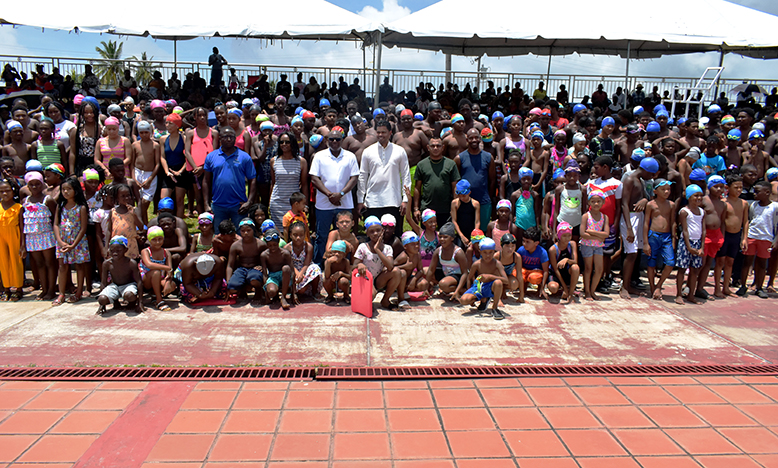 Minister of Sports, Charles Ramson Jr. (centre) flanked by Director of Sport, Steve Ninvalle and Assistant Director of Sport, Melissa Dow-Richardson, with  students, teachers, parents and coaches following Sunday's closing ceremony (Carl Croker photo)