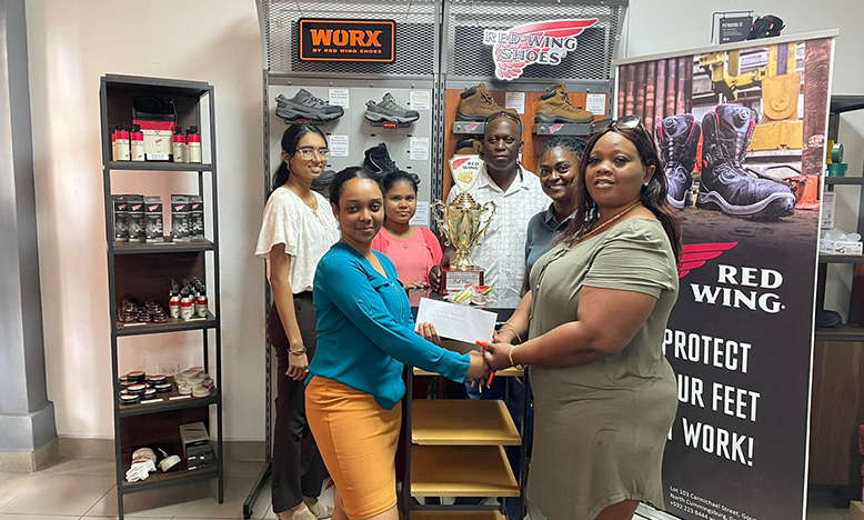 In photo, Charlyn Barnwell receives the third-place trophy with medals and sponsorship cheque from Sales executive Kerisha Beete, while other Sales executives Houshadi Arjune, Lisa Ganesh, Customs Manager Yoletta Bynoe and organiser Roderick Harry savour the moment.